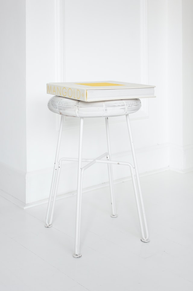 A book placed on a stool with